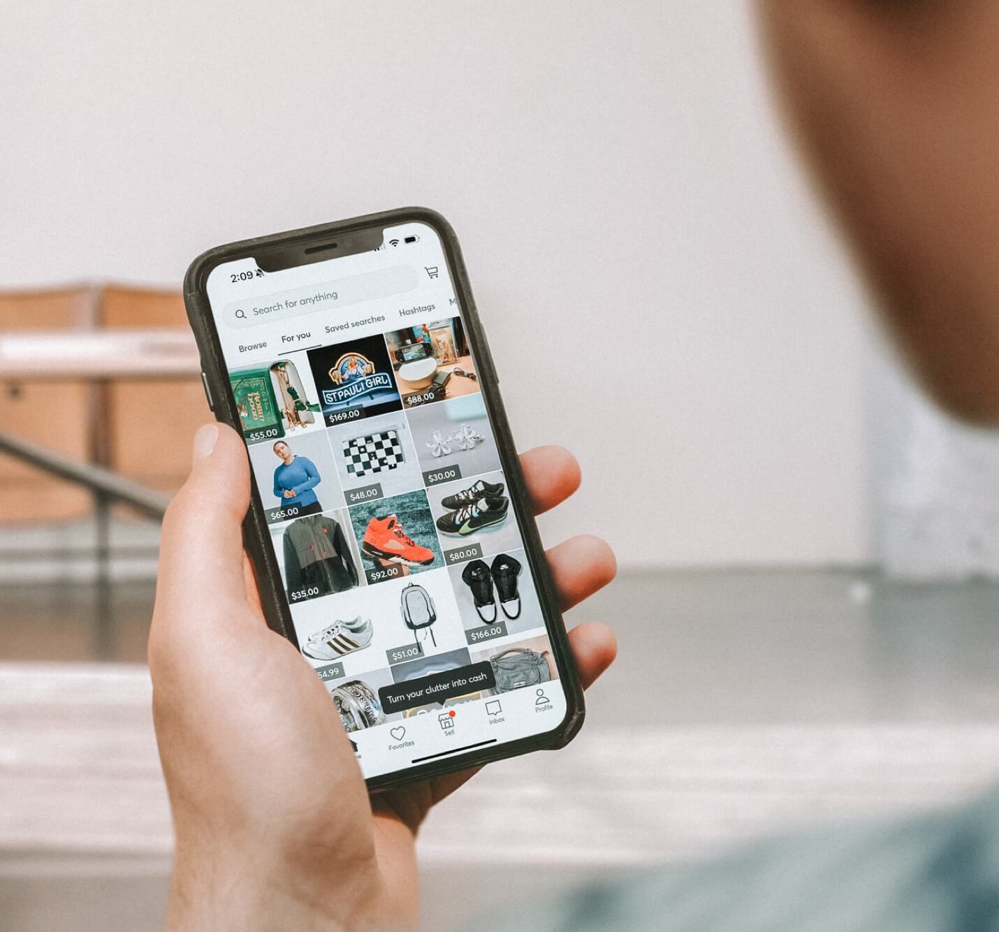 A person browsing listings in the Mercari app